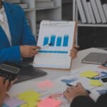 meeting-with-business-partners-to-discuss-financial-advisors-to-analyze-market-growth-charts-in-business-reports-and-plan-investment-strategies-free-photo